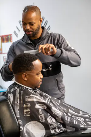 Ryan is the owner of Slick Barbers he was born and grew up in Dudley and has been a long standing black business owner on Dudley High Street. He opened his shop when he was in his late teens and continues to be a role model in Dudley's Black community.  - 2021-07-31 Do Fest 2 (Edited)-12.jpg